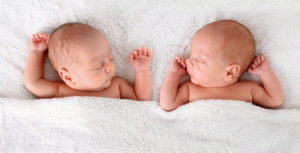 Sleeping newborn identical boy twins.